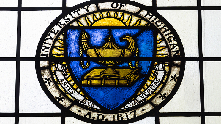 Stained glass University of Michigan seal.